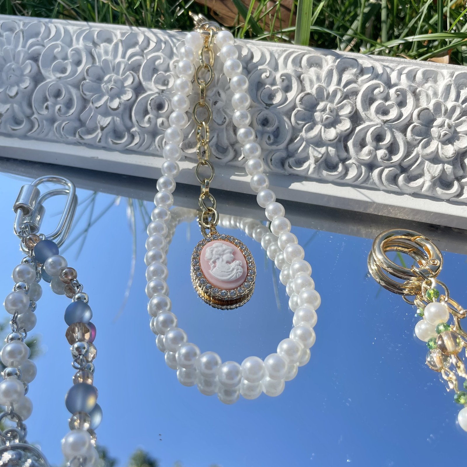 Handmade by Karissa pearl and cameo bag charms